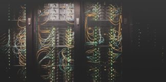 The Complete Guide to 16 Different Types of Servers image of different types of servers in a dark room