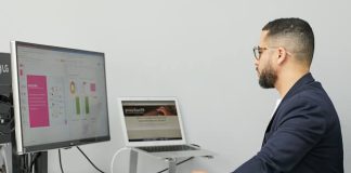 A Complete Guide to AI and Business Analytics man using a computer with AI and Business Analytics dashboard on the computer screen